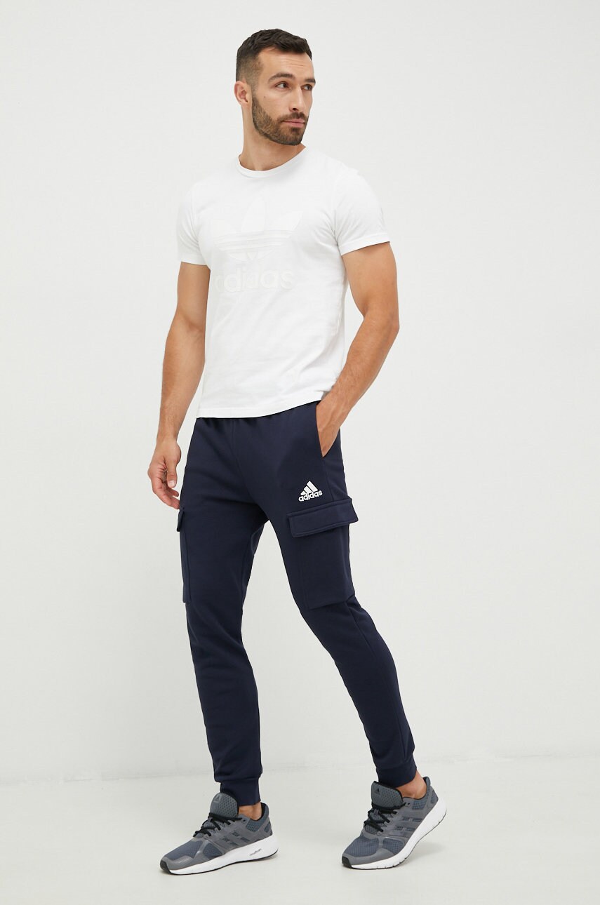 Спортивні штани adidas чоловічі колір синій однотонні