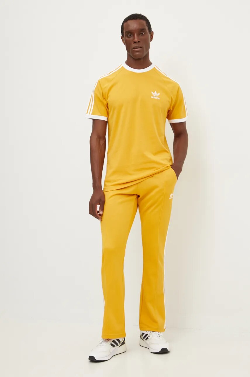 Спортивні штани adidas Originals 70S Track Pant колір жовтий з аплікацією IX5223
